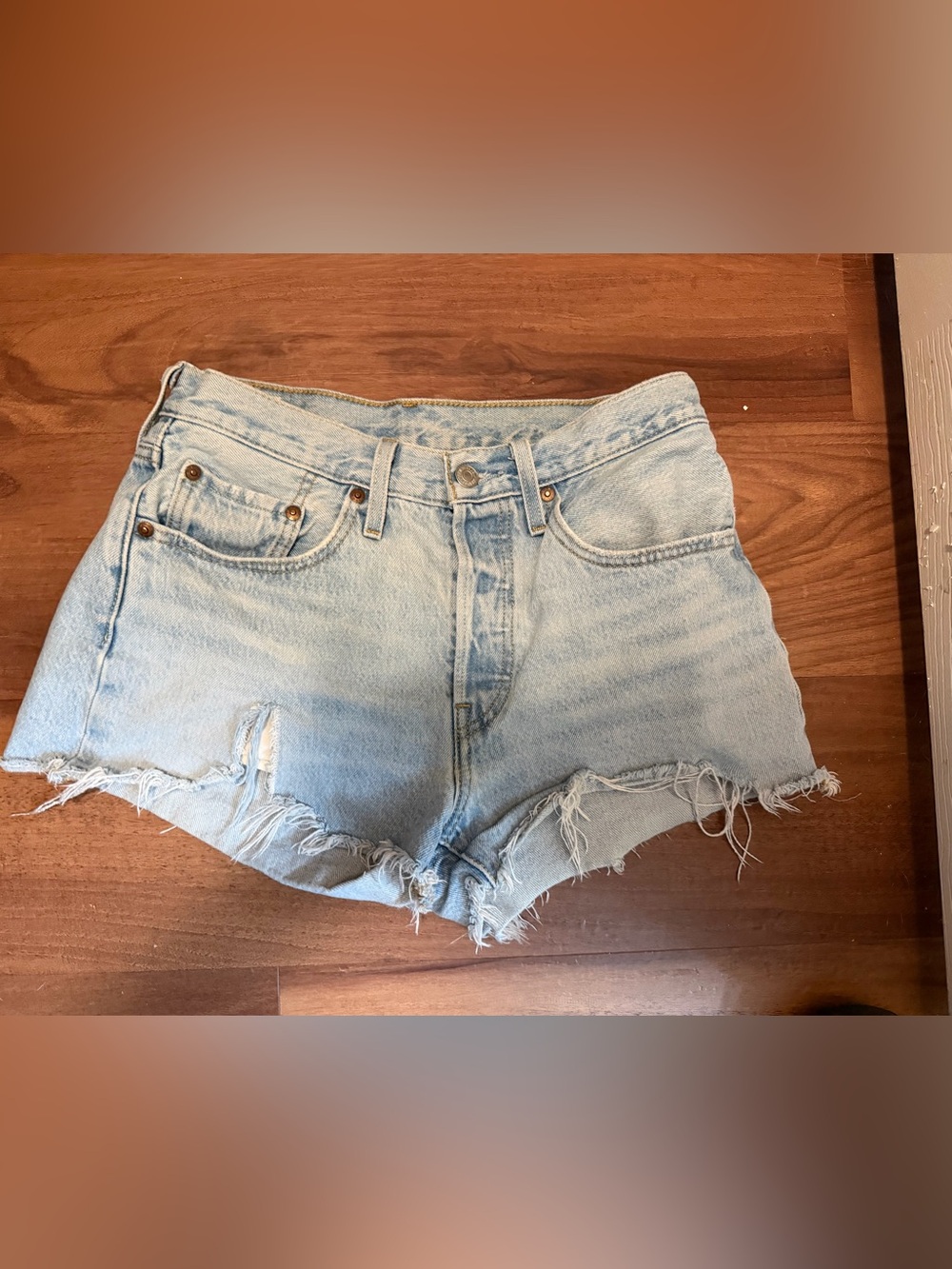 Levi's 501 Cut-Off Denim Shorts in a light wash 27